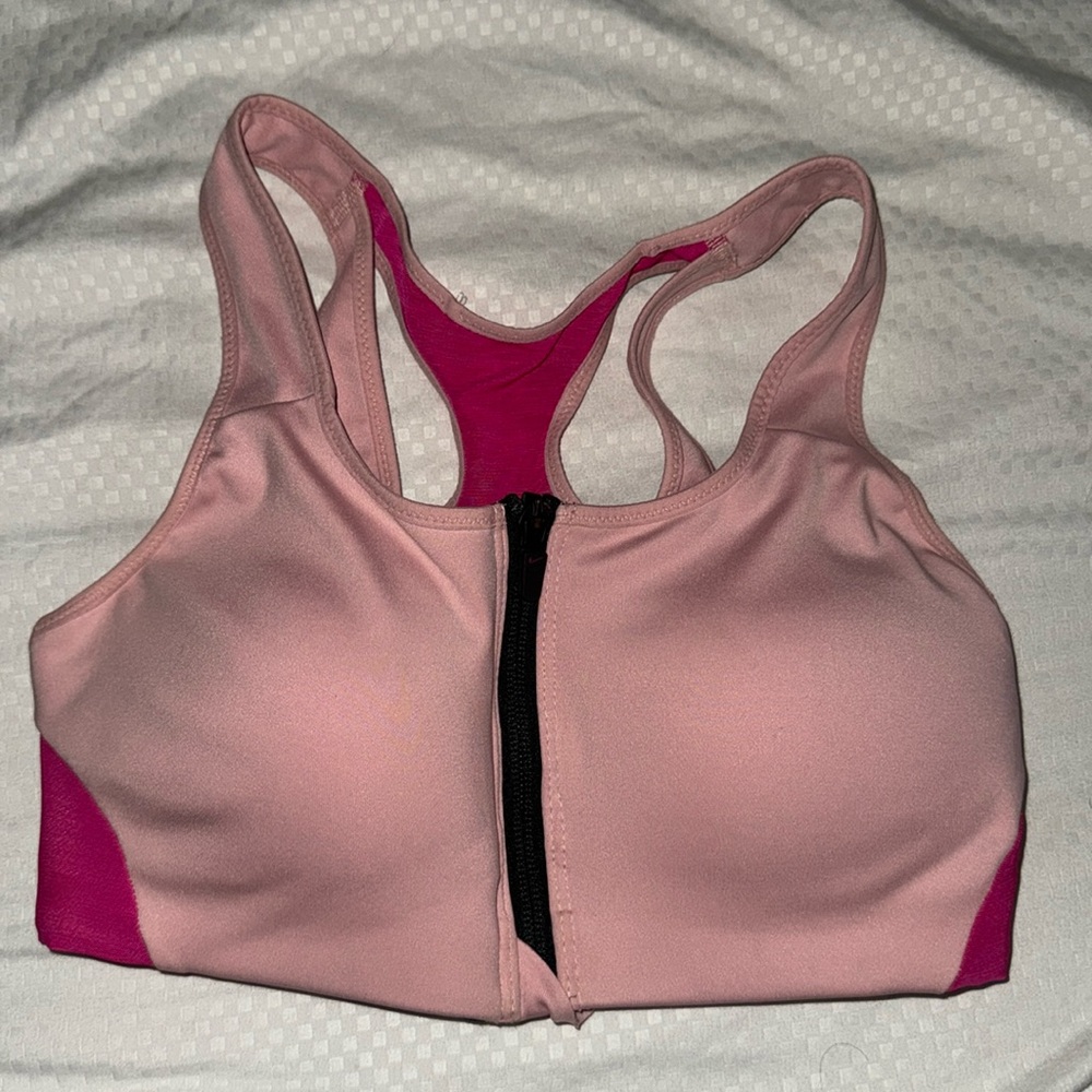 Pink Nike Sports Bra. zipper on front, great quantity